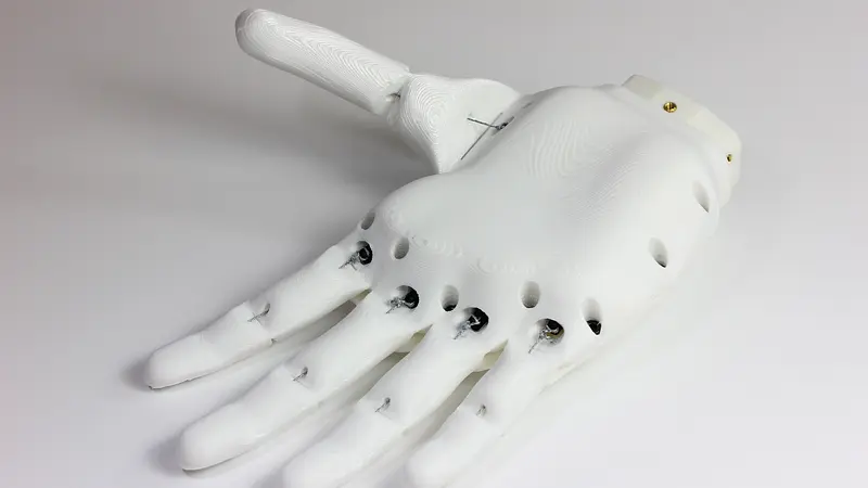 Photograph of the assembled Ada hand from Open Bionics’ project gallery. The interactive preview below shows only the palm-and-fingers component.
