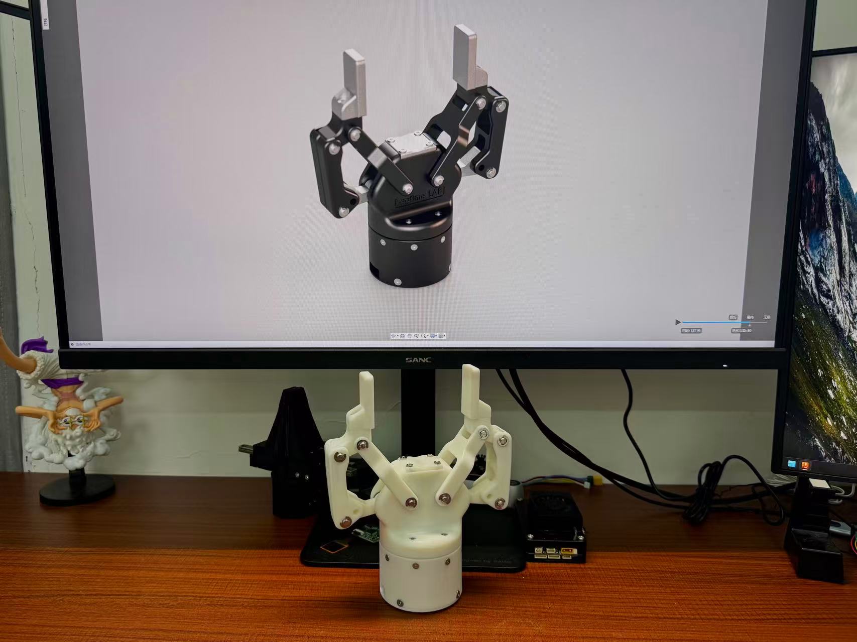 Upstream photograph of a Rhino V2 build, with its CAD design visible on the monitor. This is the maintainer’s build, not a build tested by us.
